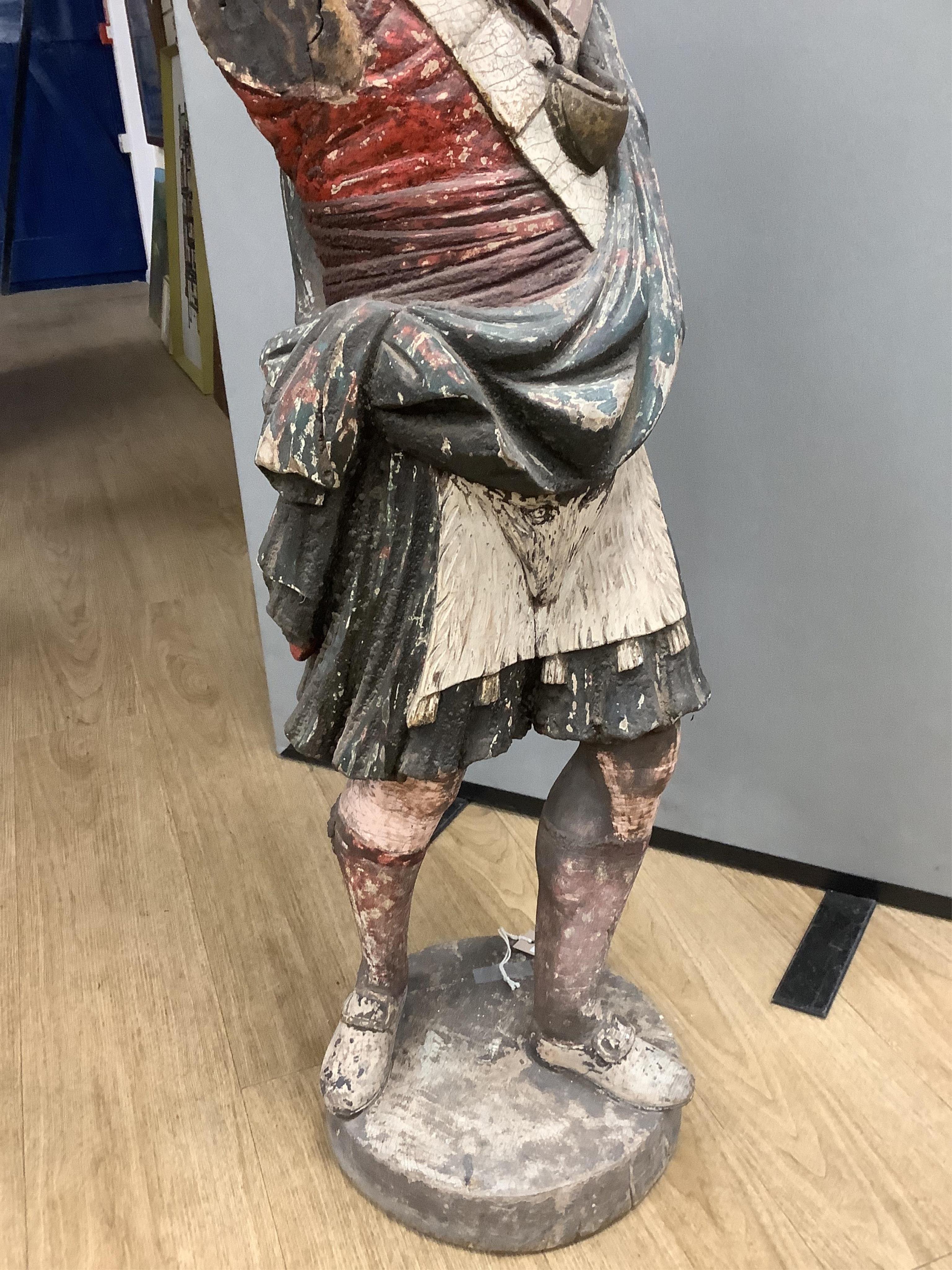 A large 19th century carved and painted Highlander ‘Snuff’ shop advertising figure. 109cm high. Condition - paint work and base weathered, arms detached.